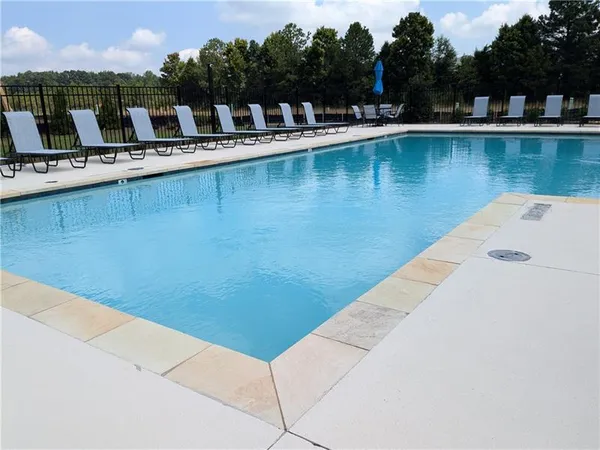 a view of a lake with a sitting area