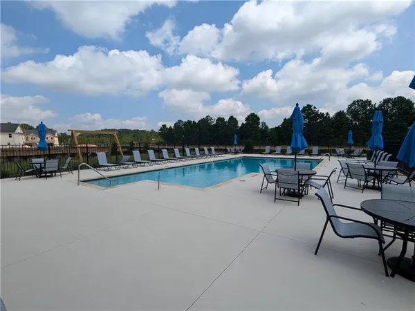 a view of a lake with outdoor seating