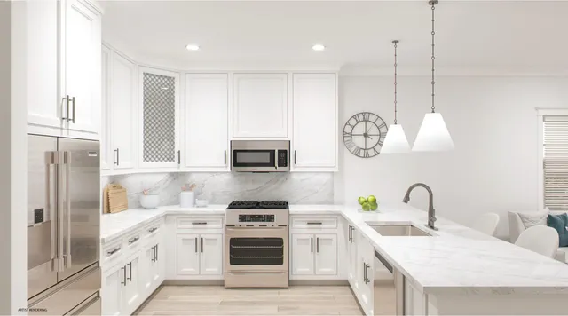 a kitchen with stainless steel appliances granite countertop a stove a sink and a refrigerator