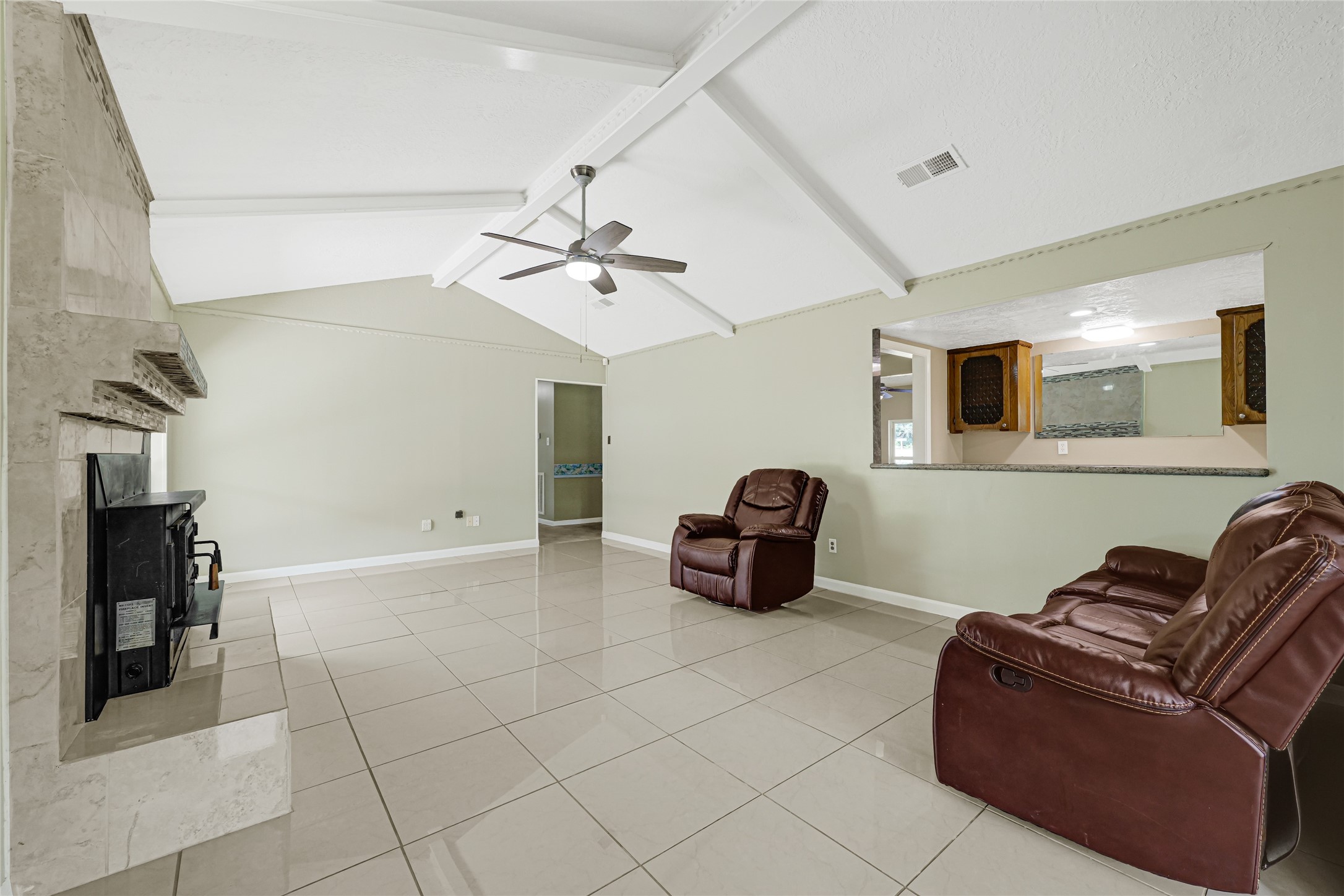 20135 Timber Line Lane New Caney, TX 77357 - Photo 10 of 30 a living room with furniture and a chandelier