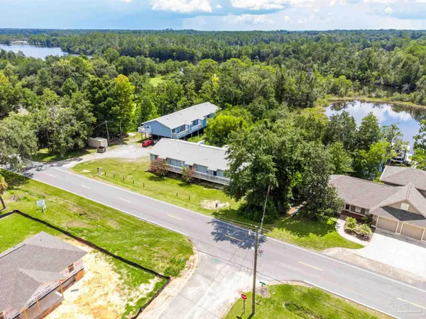 a view of a swimming pool with a yard