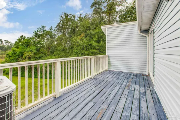 a view of balcony with wooden floor