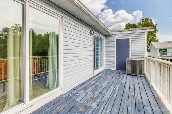 a view of a house with backyard and wooden floor