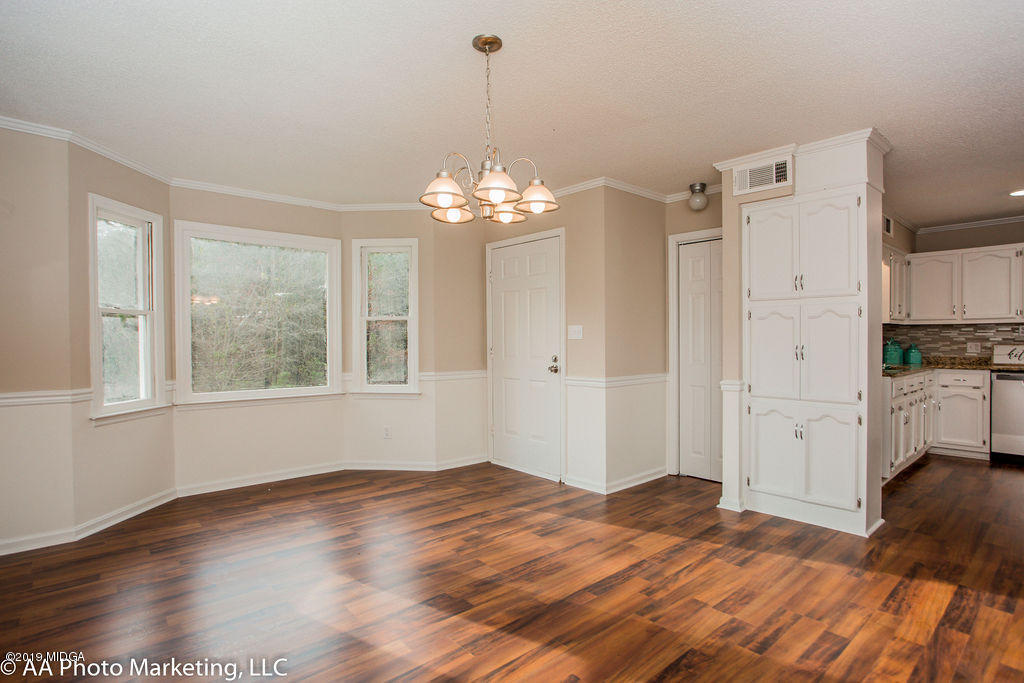 922 Woolfolk Road Fort Valley, GA 31030 - Photo 13 of 38 a view of a room with wooden floor and window