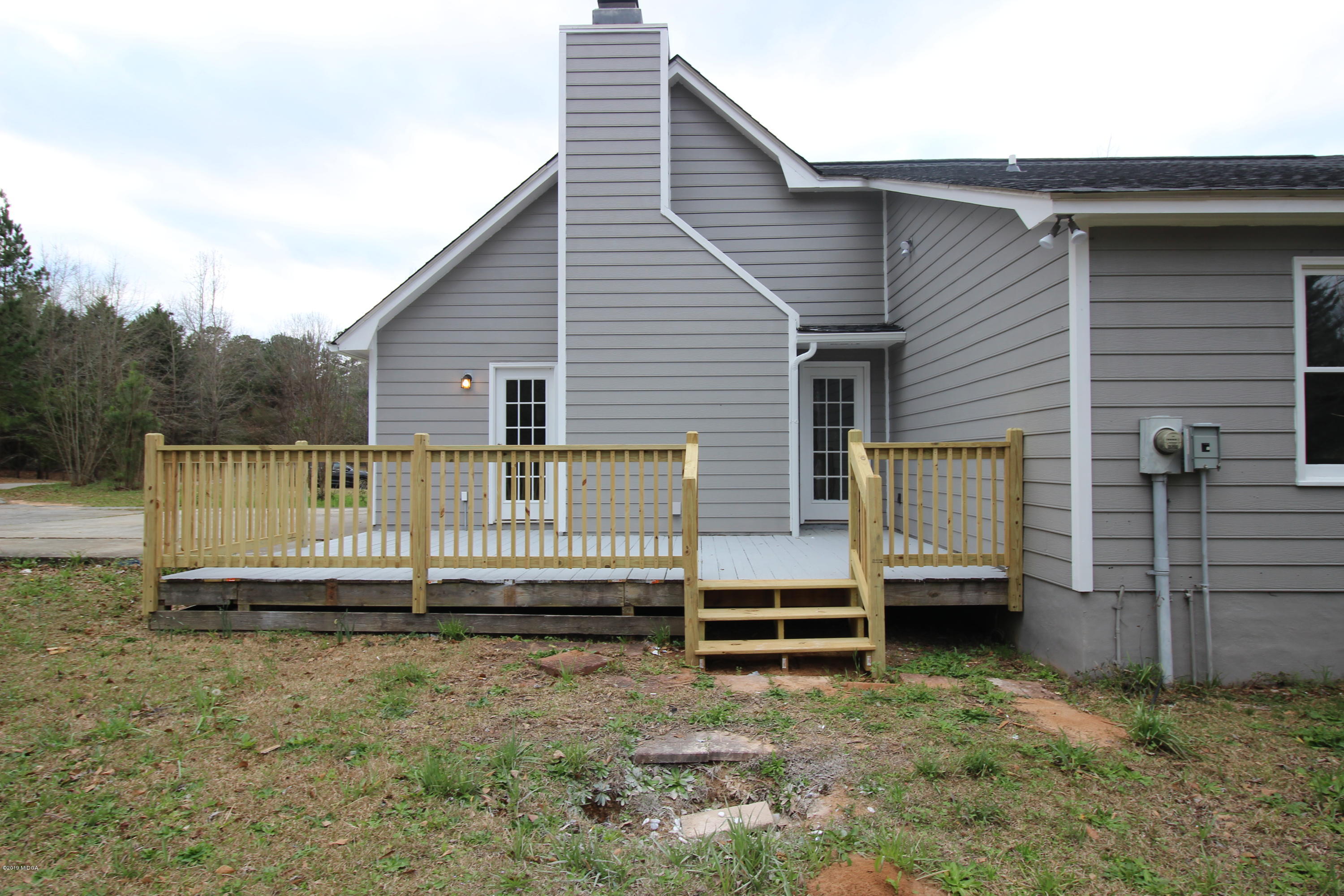 922 Woolfolk Road Fort Valley, GA 31030 - Photo 37 of 38 a view of backyard with deck