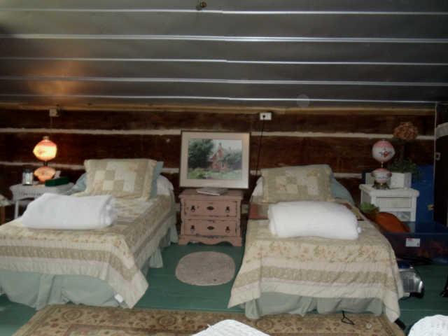 905 Gunter Ridge Road Pulaski, TN 38478 - Photo 18 of 18 a bed with white sheets and pillows