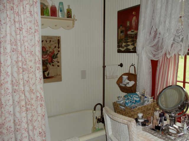 905 Gunter Ridge Road Pulaski, TN 38478 - Photo 4 of 18 a bathroom with a sink a toilet and a mirror