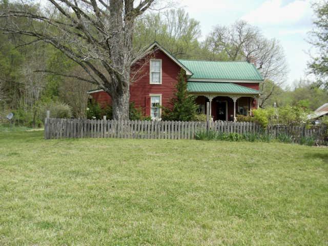 905 Gunter Ridge Road Pulaski, TN 38478 - Photo 7 of 18 a front view of a house with garden