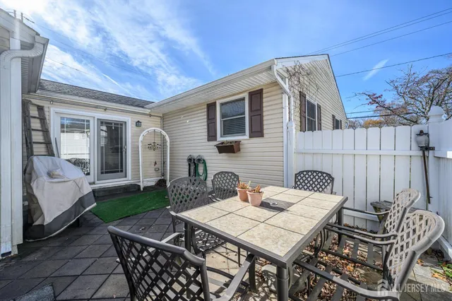 a view of a patio with a yard
