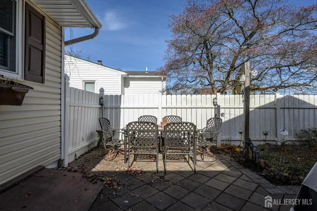 a view of backyard with sitting area