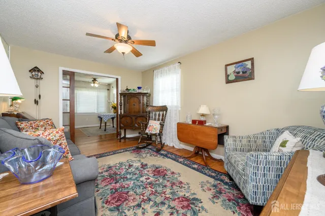 a living room with furniture and a rug