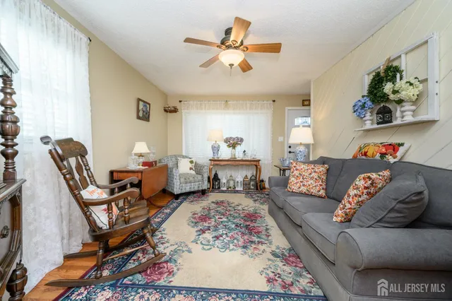 a living room with furniture and a rug
