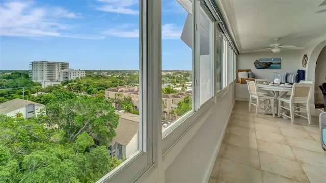 a view of a balcony with chairs