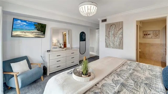 a bedroom with a bed and dresser