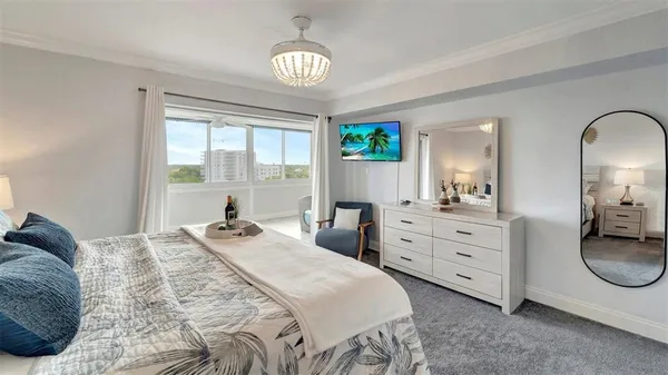 a bedroom with a bed and windows