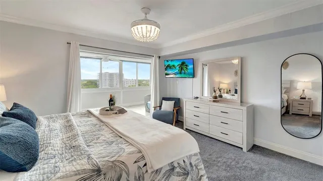 a bedroom with a bed and windows