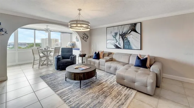 a living room with furniture a fireplace and a table