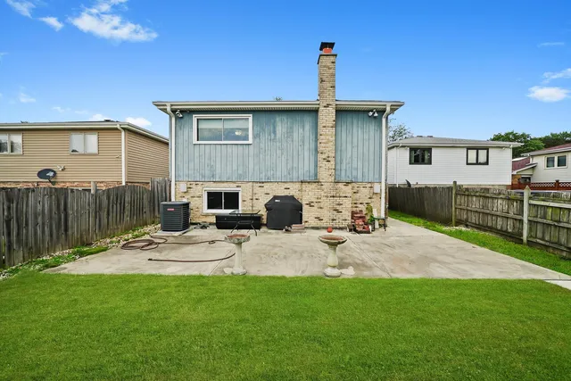 a view of a backyard with furniture