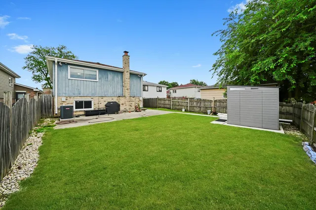 a house view with a sitting space and garden