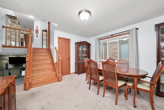 a dining room with furniture and entryway