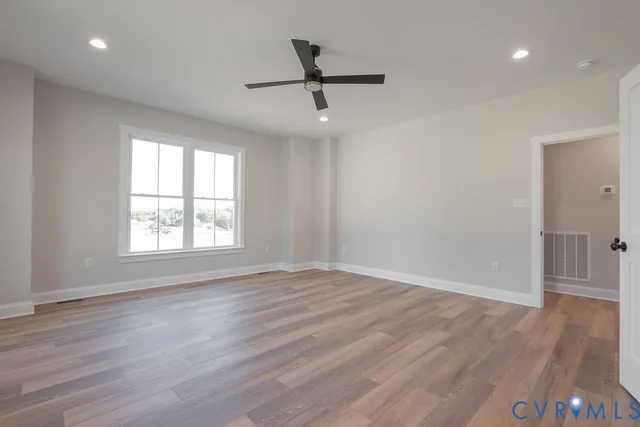 a bathroom with a granite countertop sink mirror and shower