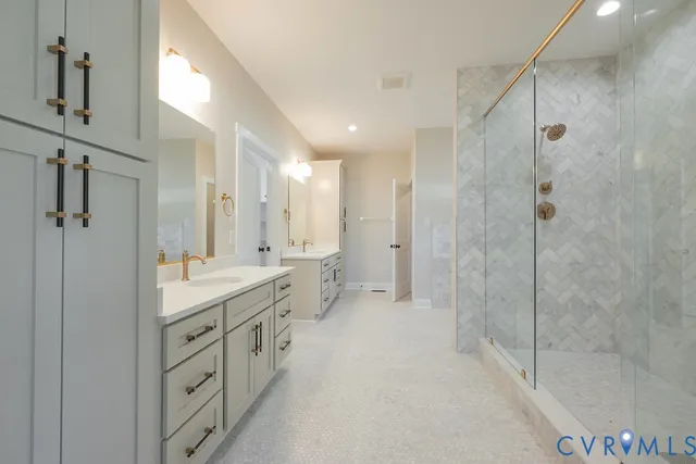a bathroom with a shower and a glass door