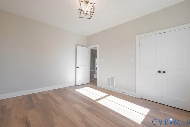 a bathroom with a sink a toilet a mirror a bathtub and shower