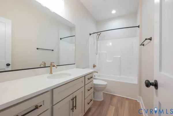 a view of a kitchen with wooden floor