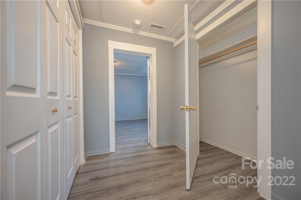 147 North Ridgecrest Avenue Rutherfordton, NC 28139 - Photo 13 of 21 a view of a hallway with wooden floor