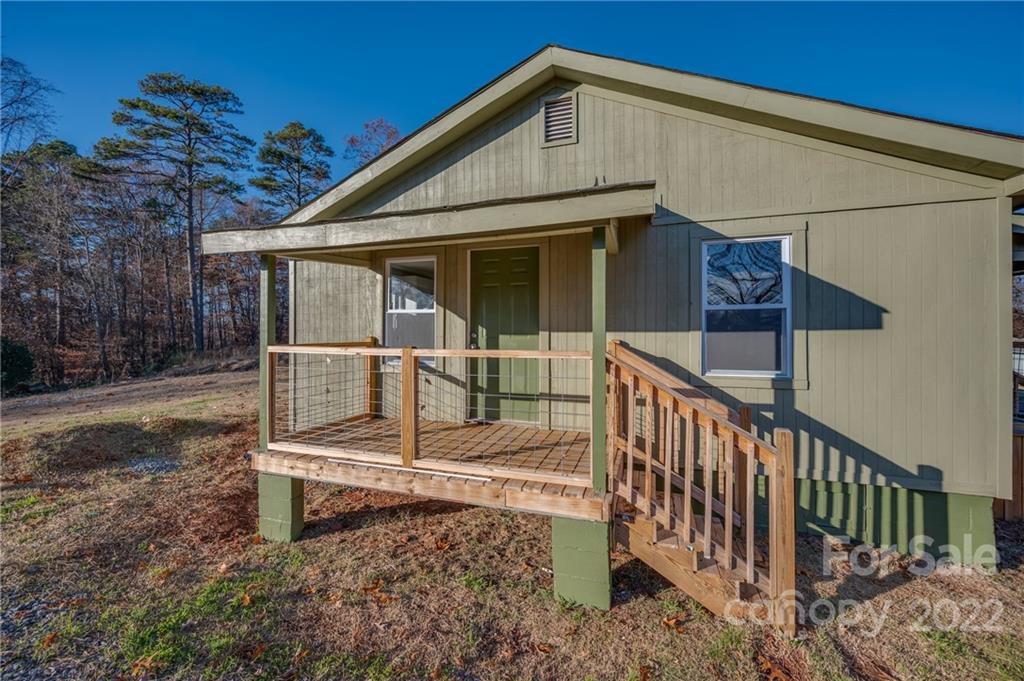 147 North Ridgecrest Avenue Rutherfordton, NC 28139 - Photo 15 of 21 a front view of a house with wooden fence