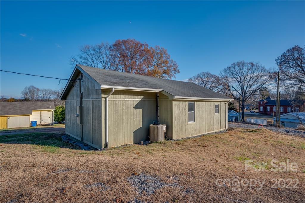 147 North Ridgecrest Avenue Rutherfordton, NC 28139 - Photo 16 of 21 a view of a house with a yard and garage