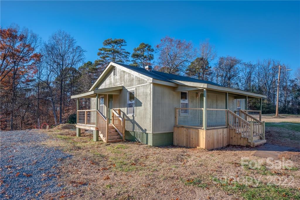 147 North Ridgecrest Avenue Rutherfordton, NC 28139 - Photo 19 of 21 a view of a house with a yard and a large tree