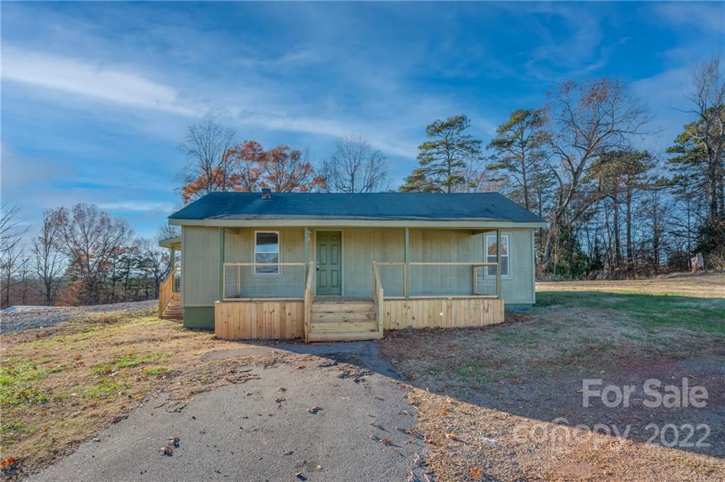 147 North Ridgecrest Avenue Rutherfordton, NC 28139 - Photo 21 of 21 a front view of a house with a yard and garage