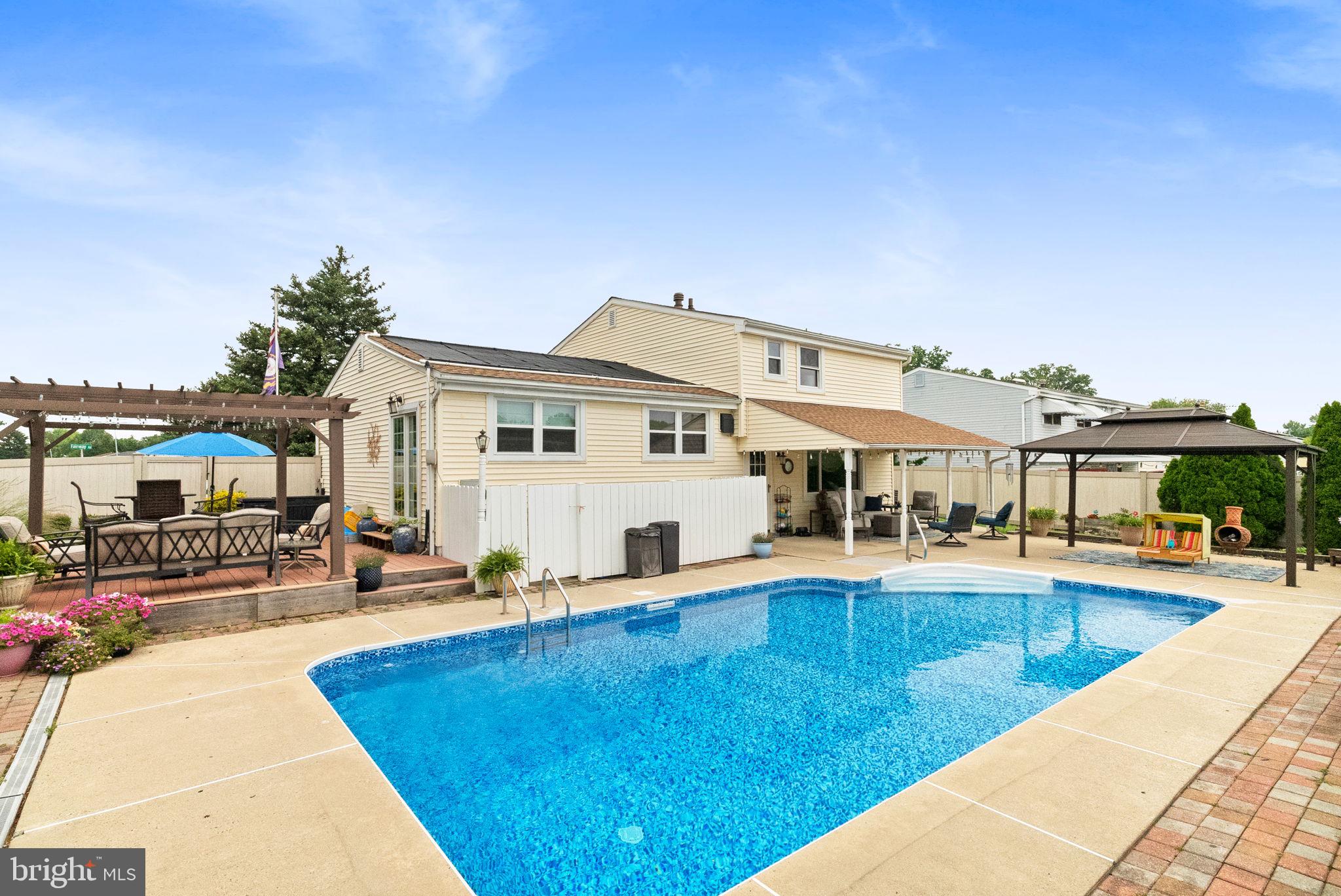 3201 Fairway Road Bensalem, PA 19020 - Photo 2 of 54 a view of a swimming pool with a patio