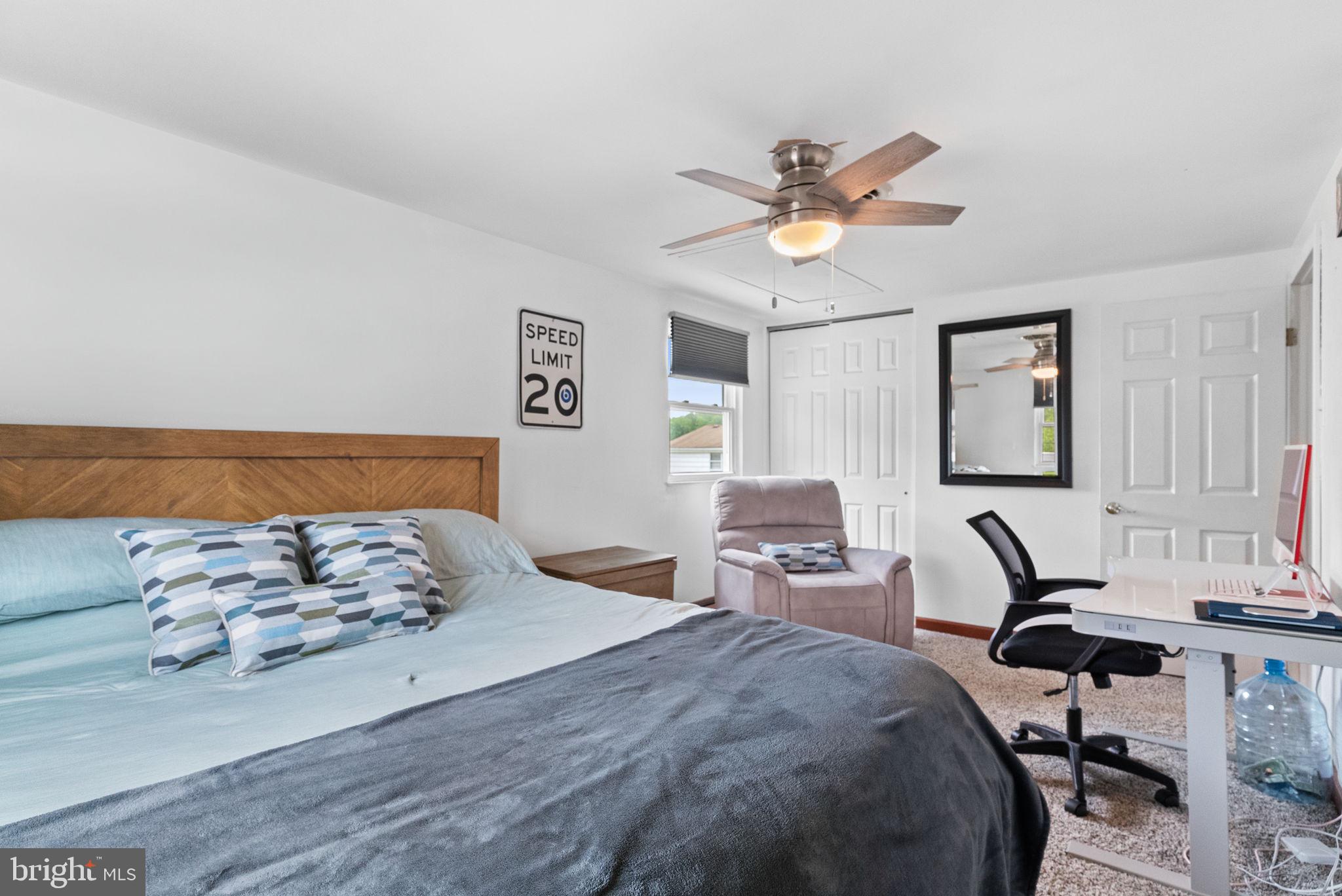 3201 Fairway Road Bensalem, PA 19020 - Photo 45 of 54 a bedroom with a bed and a chandelier