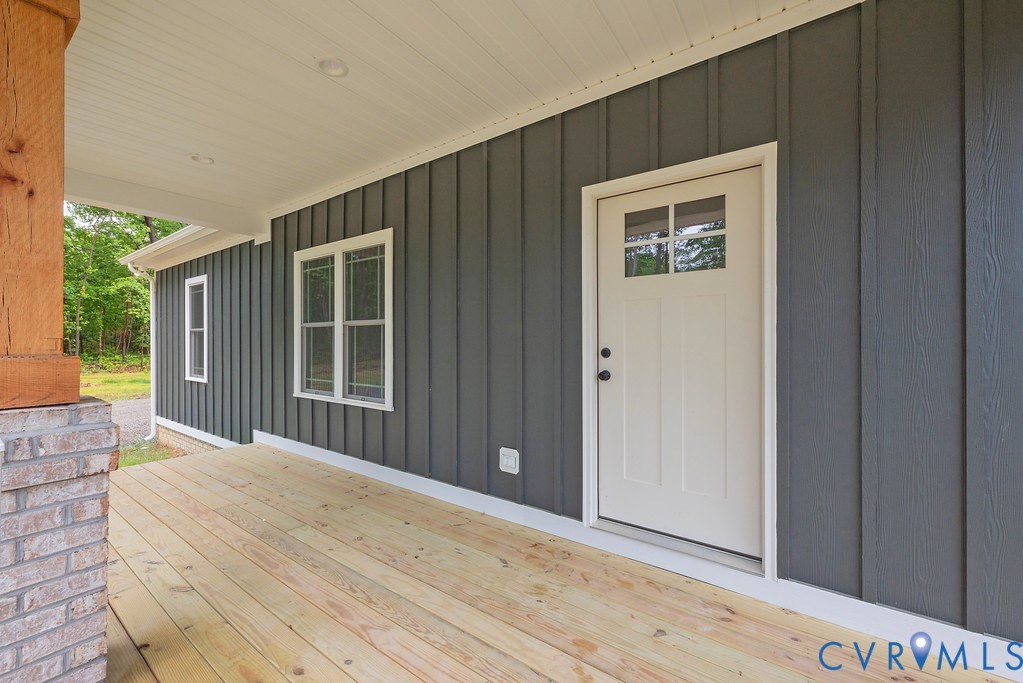 1 Tabscott Road Kents Store, VA 23084 - Photo 5 of 42 Covered porch featuring natural wood flooring, boa