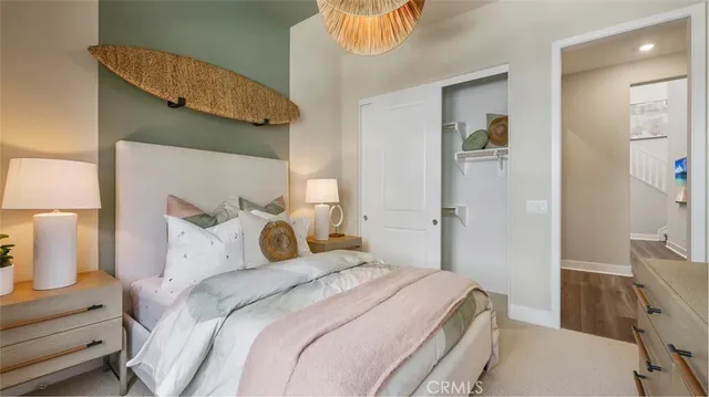 a bedroom with a bed and a lamp