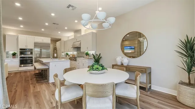 a kitchen with a table and chairs in it