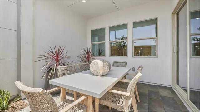 a view of a dining room that has a table and chairs