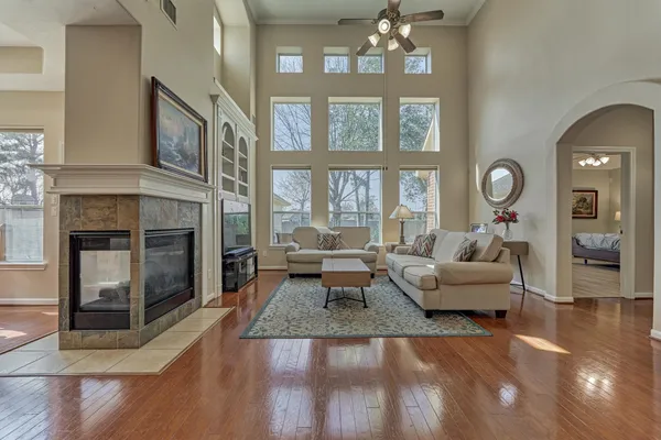 a living room with furniture and a fireplace