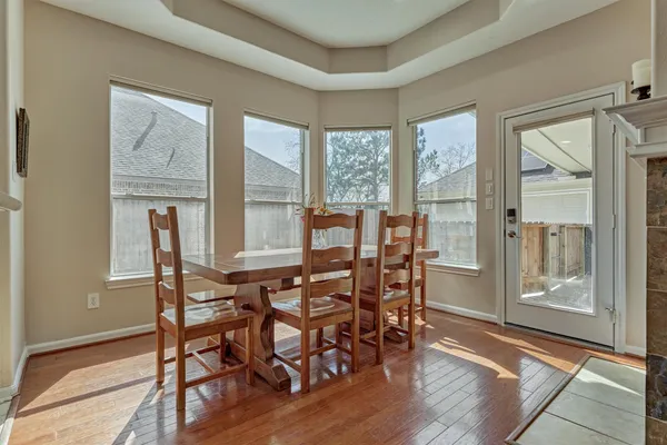 a view of a dining room with furniture and windows
