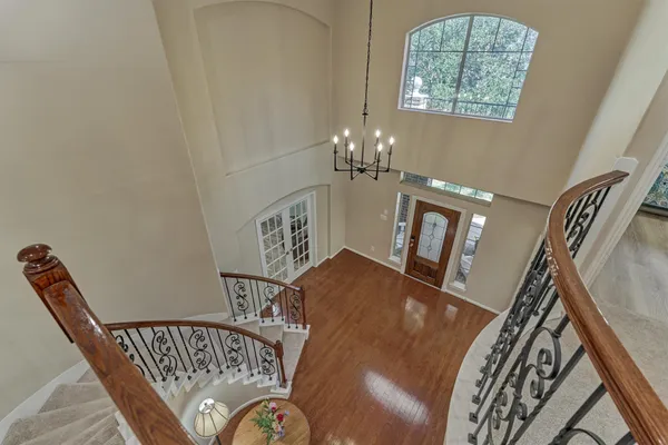 a view of a livingroom with furniture window and wooden floor