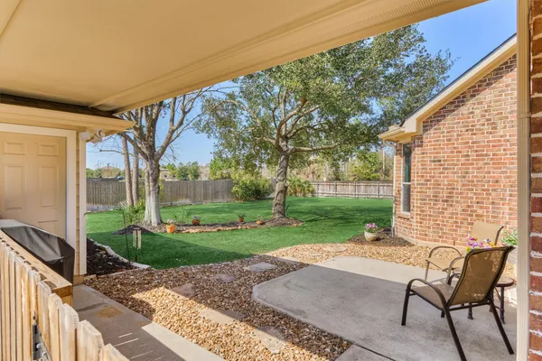 a view of a park with large trees