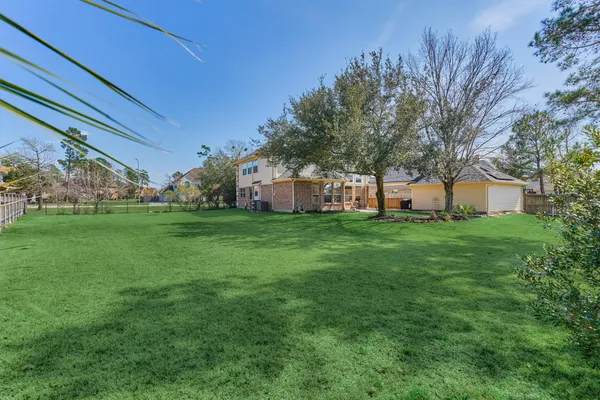 a front view of house with a garden
