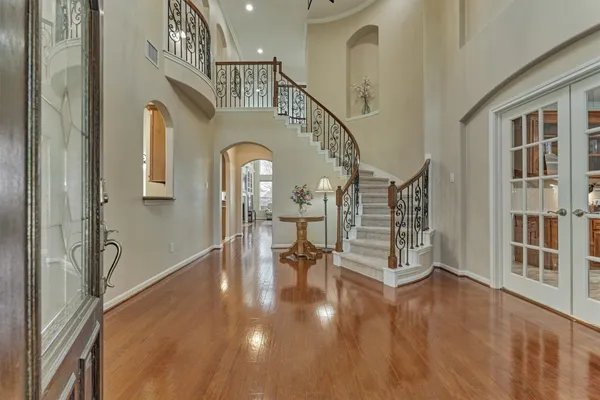 a view of an entryway with wooden floor