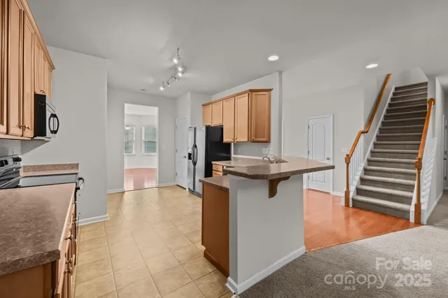 a view of a livingroom with furniture and a fireplace