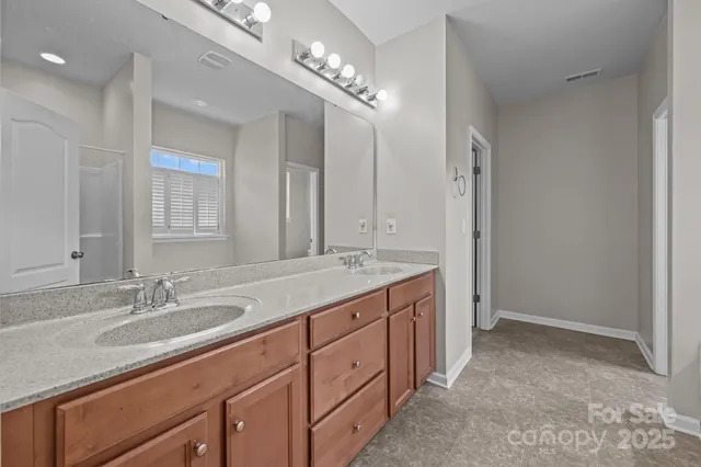 a white bath tub sitting next to a window