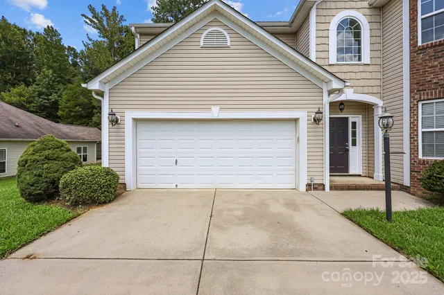 a front view of a house with a garage