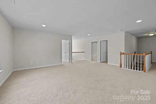 a bathroom with a double vanity sink toilet mirror and bathtub