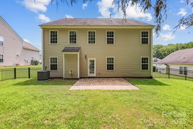 a view of a park with large trees